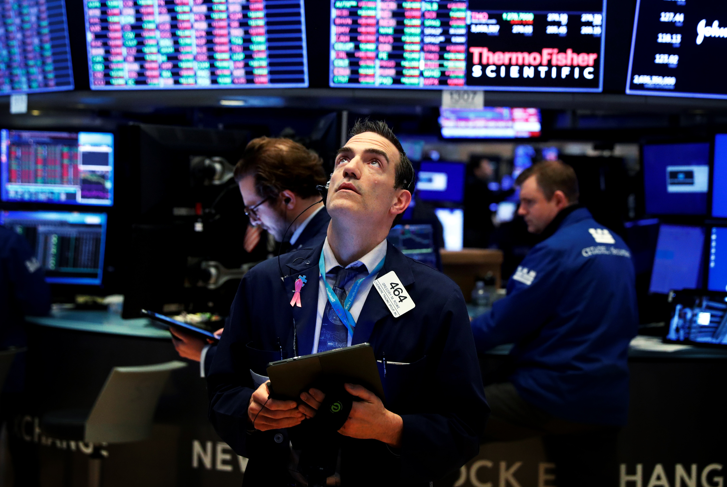 Image: Traders work on the floor of the New York Stock Exchange (NYSE) as the building prepares to close indefinitely due to the coronavirus disease (COVID-19) outbreak in New York