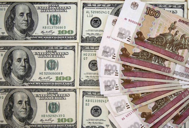 A picture illustration shows Russian rouble and U.S. dollar banknotes in Sarajevo